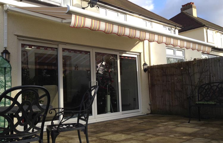Awning over patio and french window