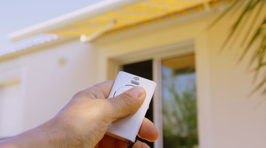 Hand with awning remote control